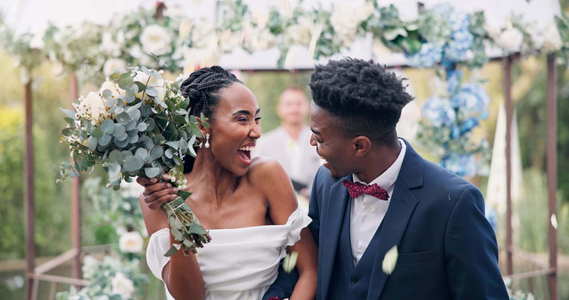 Couple, flower confetti and outdoor wedding with event, walk and happy laugh in nature. Black woman, man and excited for marriage, floral bouquet or holding hands in park, party or together in aisle Couple, flower confetti and outdoor wedding with event, walk and happy laugh in nature. Black woman, man and excited for marriage, floral bouquet or holding hands in park, party or together in aisle